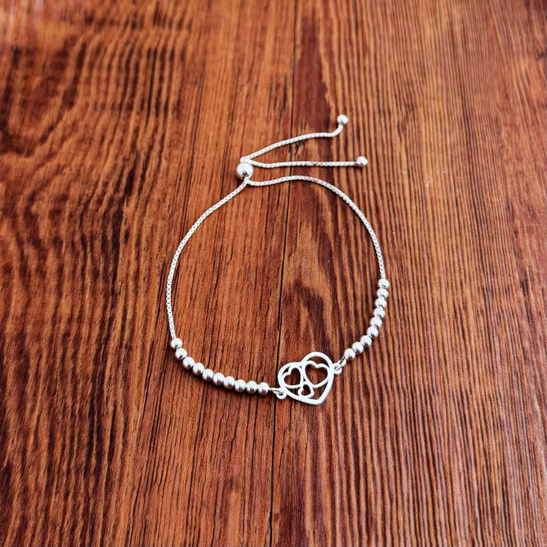 PULSERA TRIPLE CORAZON ENCAPSULADO